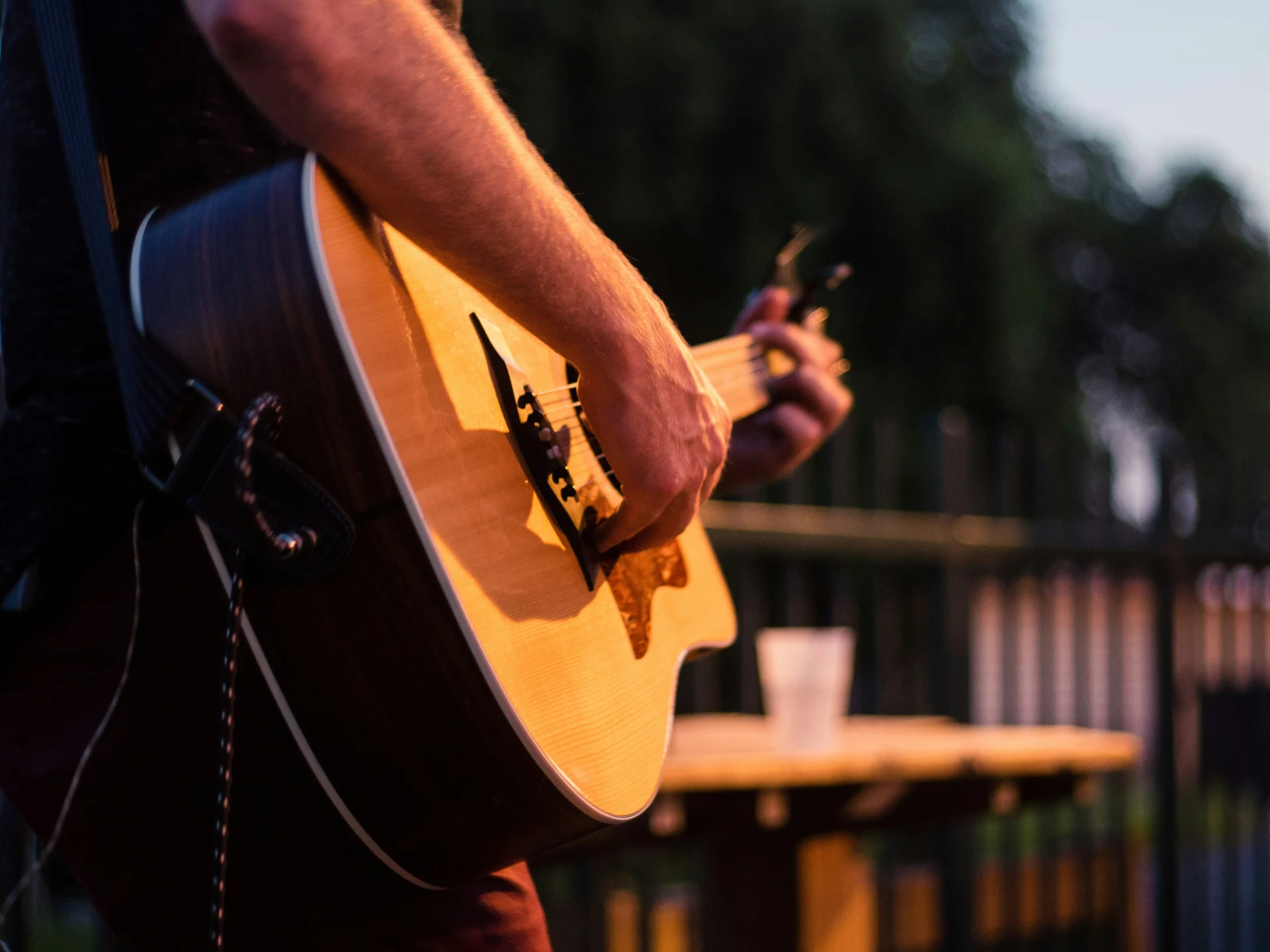 Artist playing guitar at an intimate show